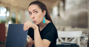 Woman on laptop worried about privacy protection.